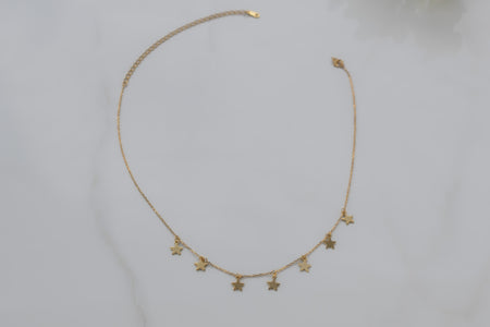 collar choker de estrellas en color oro