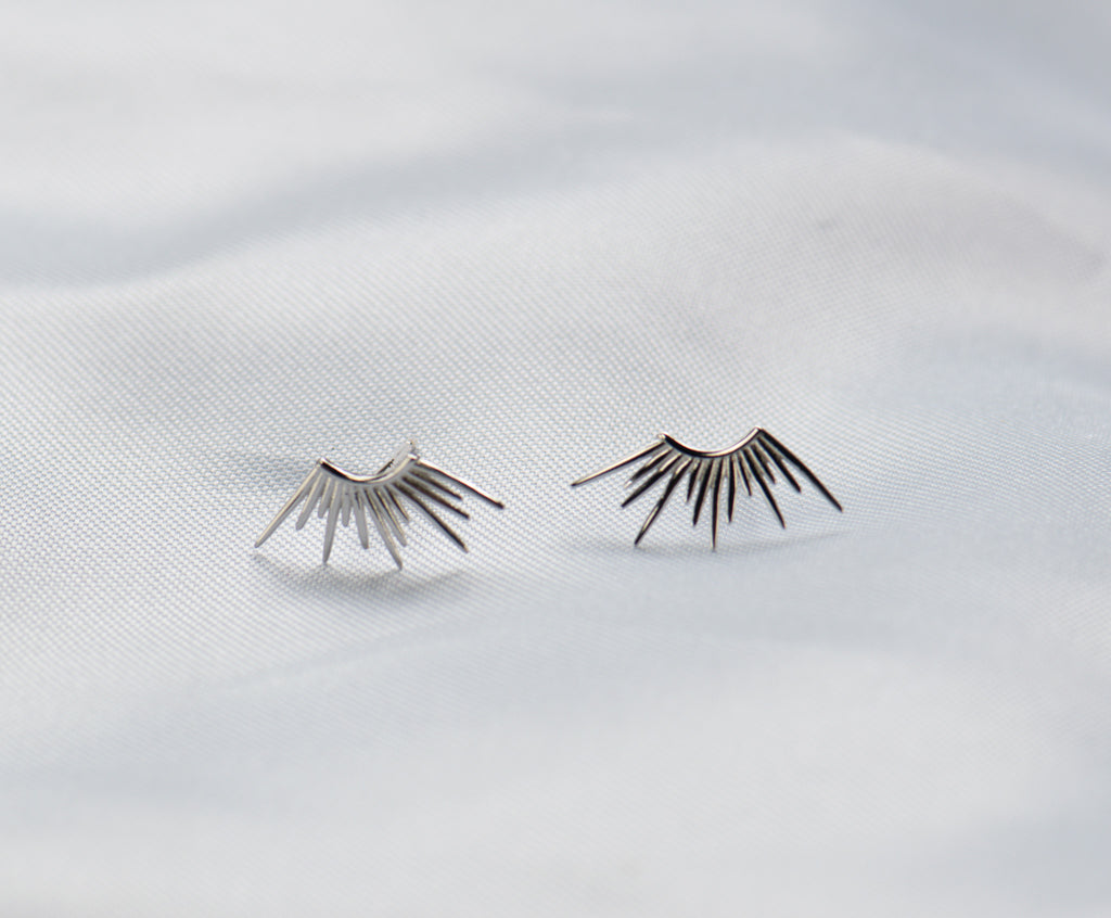 Aretes en forma de rayos de sol en plata 925