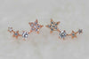 Aretes tipo climbers de estrellas con baño de oro rosa 18k