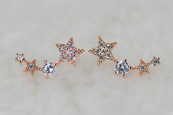 Aretes tipo climbers de estrellas con baño de oro rosa 18k