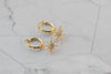Aretes de argolla pequeña en baño de oro 18k con estrella lucero de zirconias blancas