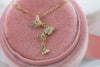 Pendiente de cuatro mariposas color oro con zirconias