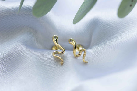 Aretes de serpiente en baño de oro 18k con ojo de zirconia