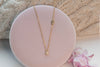 Collar con cadena y dos cruces pequeñas con baño de oro 18k