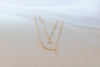 Detalle de Collar cadena doble y pendiente de estrella con baño de oro 18k