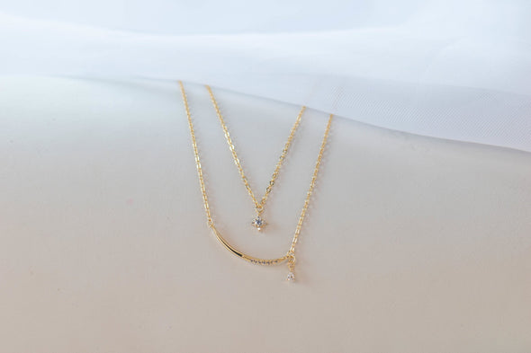 Detalle de Collar cadena doble y pendiente de estrella con baño de oro 18k