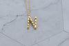 Collar con pendiente letra N color oro